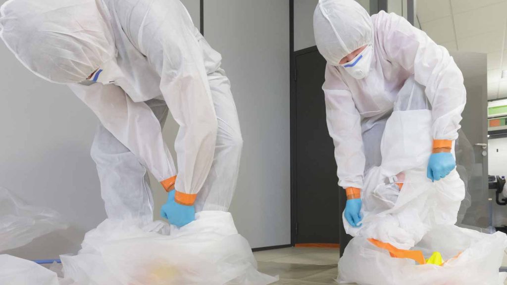 Workers wearing protective suit 558199210